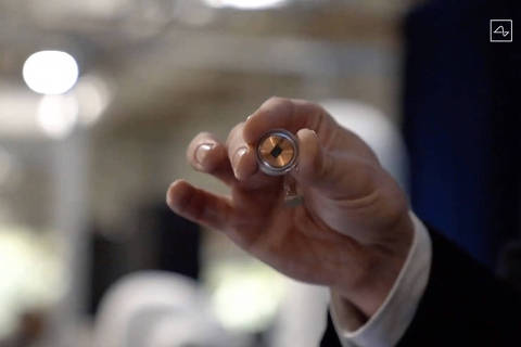 (FILES) This video grab made from the online Neuralink livestream shows the Neuralink disk implant held by Elon Musk during the presentation on August 28, 2020. Elon Musk's start-up Neuralink on May 25, 2023 said it has gotten approval from US regulators to test its brain implants in people.
Neuralink said clearance from the US Food and Drug Administration for its first in-human clinical study is 