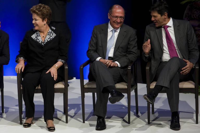 A ex-presidente Dilma Rousseff (PT), o vice-presidente Geraldo Alckmin (PSB) e o ministro da Fazenda, Fernando Haddad (PT) em evento em São Paulo em maio de 2013