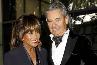 Tina Turner poses with husband Erwin Bach before Giorgio Armani's fashion show to celebrate 40th anniversary of career and to mark opening of the Expo 2015 in Milan