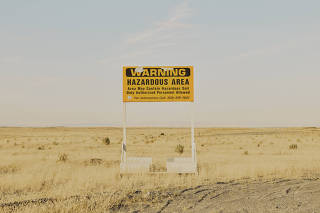 A radiation warning sign along the road near the Hanford Site in Washington state, on Aug. 10, 2022. (Mason Trinca/The New York Times)