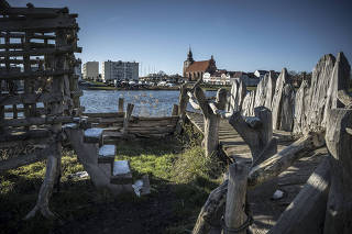A recreated Slavic Viking settlement, with medieval craft demonstrations, re-enactments and guided tours in Wolin, Poland, on March 28, 2023. (Sergey Ponomarev/The New York Times)