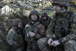 Members of the Ukrainian 95th Air Assault Brigade at a wooded artillery position in eastern Ukraine, June 1, 2023.  (Tyler Hicks/The New York Times)