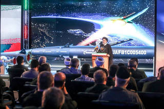 Iranian President Ebrahim Raisi speaks during the unveiling ceremony of the new ballistic missile called 