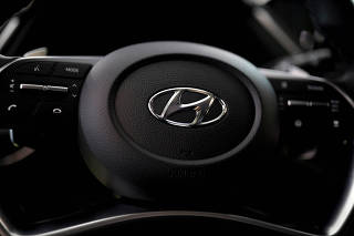 FILE PHOTO: The logo of Hyundai Motors is seen on a steering wheel on display at the company's headquarters in Seoul