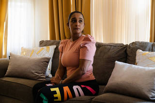 Awilda Peña, who found out she had rectal cancer when she was 38, at her home in Boston, June 1, 2023. (Sophie Park/The New York Times)