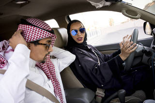 A Saudi man teaches his wife to drive in Khobar, Saudi Arabia, June 20, 2018. (Tasneem Alsultan/The New York Times)