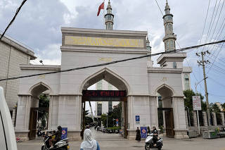 The Najiaying mosque in Nagu, in Yunnan Province, China, in June 2023. In a rare public protest, residents and police officers clashed last month over a plan to remove the mosque?s dome and remake the minarets. (Vivian Wang/The New York Times)