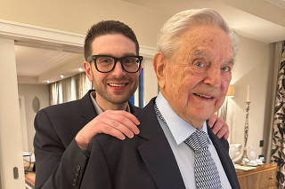 George Soros is seen with his son Alexander, in Munich