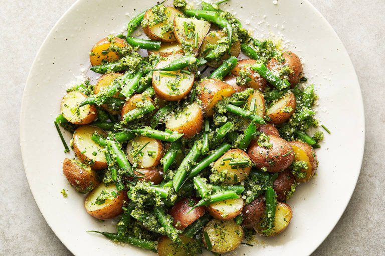 Chive pesto potato salad in New York, May 8, 2023. Peas, corn and broccoli florets are all great alternatives to the green beans in this recipe. Food styled by Cyd Raftus McDowell. (Armando Rafael/The New York Times)