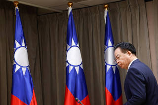Taiwan's Foreign Minister Joseph Wu arrives to a news conference in Taipei