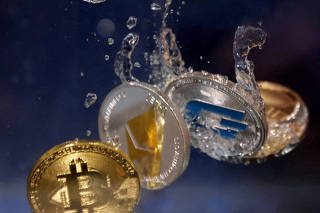 FILE PHOTO: Illustration shows representations of cryptocurrencies plunging into water
