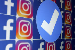 FILE PHOTO: Illustration shows blue verification badge, Facebook and Instagram logos