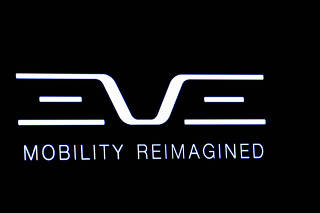 FILE PHOTO: The logo for Eve Air Mobility is displayed on a screen during the company?s debut on the floor of the NYSE in New York