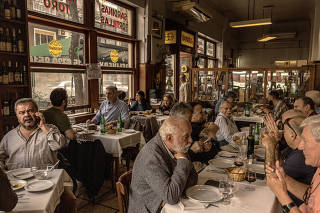 People dine at Miramar, an iconic restaurant in the working-class neighborhood of San Cristóbal, in Buenos Aires, Argentina, June 8, 2023. (Sarah Pabst/The New York Times)