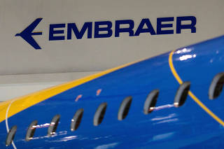 FILE PHOTO: The logo of Brazilian planemaker Embraer SA at the company's headquarters in Sao Jose dos Campos, Brazil