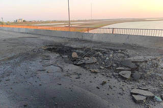 A view shows the damaged Chonhar bridge connecting Russian-held parts of Ukraine's Kherson region to the Crimean peninsula
