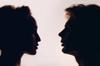 Pair couple man and woman profile portrait face to face. Family psychologist and healthy relationships concept.