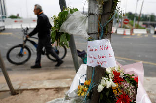 Flowers are seen following 17-year-old shot dead in Paris suburb