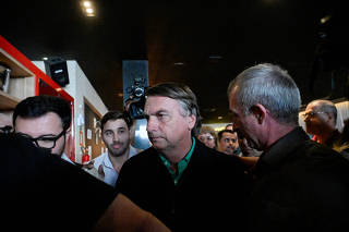 Brazil's former President Jair Bolsonaro looks on at a restaurant in Belo Horizonte