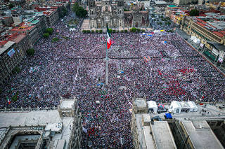 People attend an event to mark fifth anniversary of election triumph of the Mexico's President Andres Manuel Lopez Obrador, in Mexico City