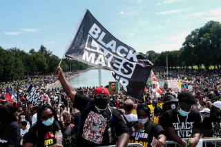 People attend a protest organizers are calling Commitment March: Get Your Knee Off Our Necks, at the Lincoln Memorial in Washington, Friday, Aug. 28, 2020. (Michael A. McCoy/The New York Times)