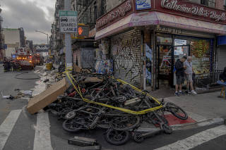 The aftermath of a fire at an e-bike repair store in the Chinatown of Manhattan, on June 20, 2023. (Amir Hamja/The New York Times)