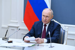 Russian President Putin attends a summit of leaders of the Shanghai Cooperation Organisation via a video conference call in Moscow