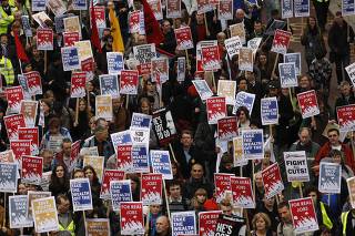 Demonstrators protest against job cuts in central London