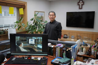 The Rev. Chun Ki-won, a Christian pastor who aids North Korean refugees fleeing through China, in his office in Seoul, South Korea, May 3, 2023. (Chang W. Lee/The New York Times)