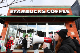 FILE PHOTO: Starbucks U.S. workers at 100 stores hold one-day walkout