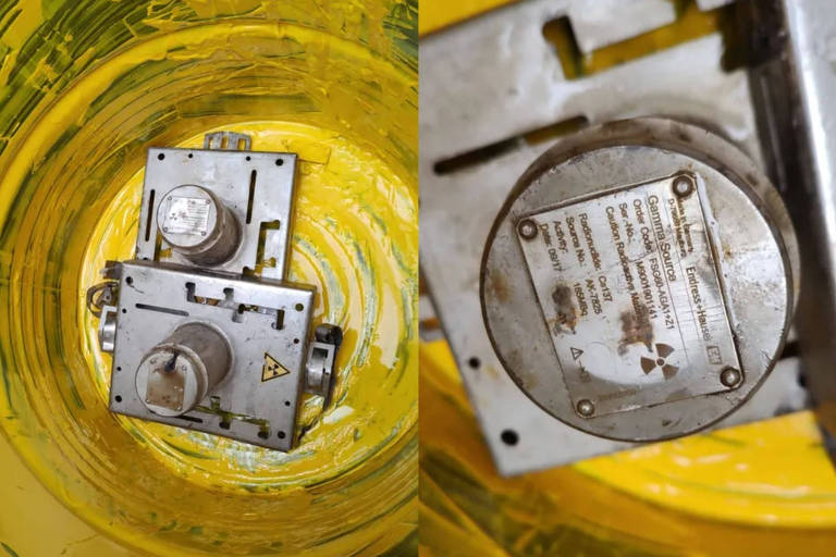Dentro de uma lata amarela estão dois equipamentos metálicos. São as fontes medidoras que contém césio-137