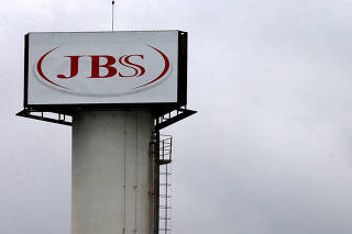 FILE PHOTO: The logo of Brazilian meatpacker JBS SA is seen in the unit   in the city of Jundiai