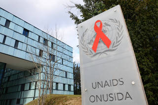 A logo is seen near the headquarters of the UNAIDS in Geneva
