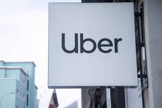 FILE PHOTO: Logo of Uber is seen at a temporary showroom during the World Economic Forum in Davos