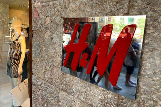 FILE PHOTO: An H&M sign is seen at the entrance to an H&M store in Palma on the island of Mallorca