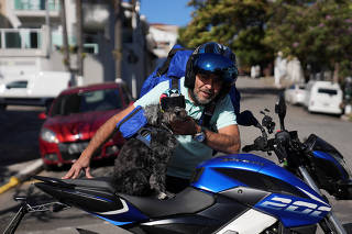 Motor-biking dog and his owner cruise Brazil's streets to help hungry pups, in Sao Paulo