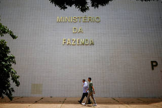 FILE PHOTO: People walk near the Ministry of Finance building in Brasilia