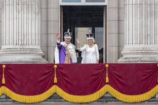 King Charles and Queen Camilla on the balcony at Buckingham Palace on the day of the king's coronation in London, May 6, 2023. (Andrew Testa/The New York Times)