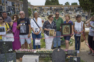 Descendants of victims of Gen. Francisco FrancoÕs firing squads at the cemetery where 2,200 people were executed, in Paterna, Spain, on June 26, 2023. (Samuel Aranda/The New York Times)