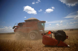 FILE PHOTO: Soybeans are harvested at a farm in Luziania, state of Goias
