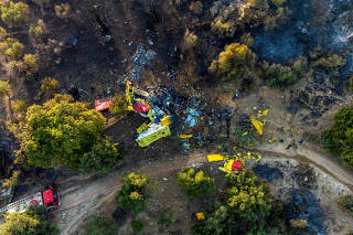 Firefighting plane crashes as a wildfire burns in Evia