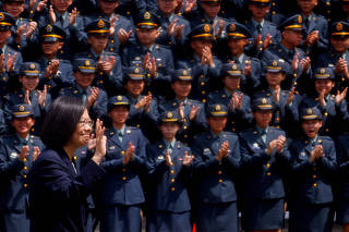 Taiwan's President Tsai Ing-wen waves to students during their graduation ceremony at the National Defense University in Taipei