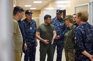 Ukraine's President Zelenskiy speaks visits a military hospital in the town of Ochakiv