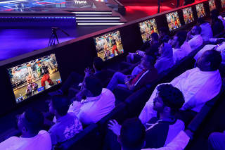 Spectators watch video games as gamers from different countries play during an esports and gaming festival Gamers8 at Boulevard Riyadh