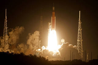 FILE PHOTO: NASA's next-generation moon rocket lifts off on the unmanned Artemis I mission to the moon at Cape Canaveral