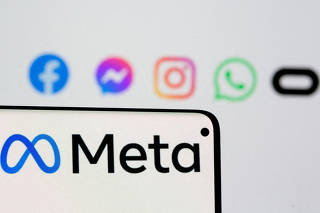 FILE PHOTO: Facebook's new rebrand logo Meta is seen on smartphone in this illustration picture