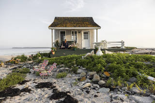 The tiny cabin on Duck Ledges Island that Charlotte Gale, a licensed massage therapist from New Jersey, purchased in Wohoa Bay,  Maine, on July 12, 2023. (Greta Rybus/The New York Times)