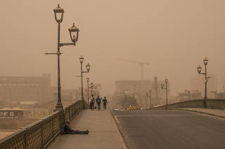 A dust storm in central Baghdad on July 13, 2022. (Bryan Denton/The New York Times)