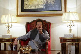 Imran Khan delivers a press conference at his home in Lahore