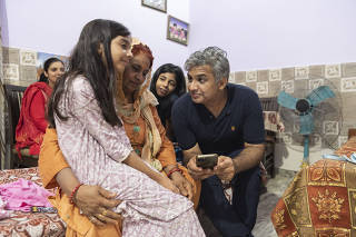 Sunil Jaglan at home with his family in Bibipur, India, July 30, 2023. (Saumya Khandelwal/The New York Times)